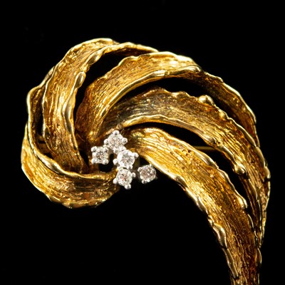 Lot 74 - A 1960's 9ct gold diamond set five stone brooch.