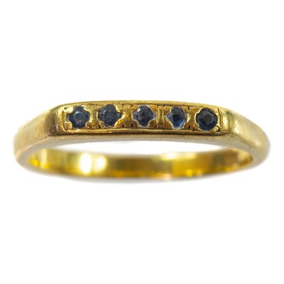 Lot 58 - An 18ct gold sapphire set five stone ring.