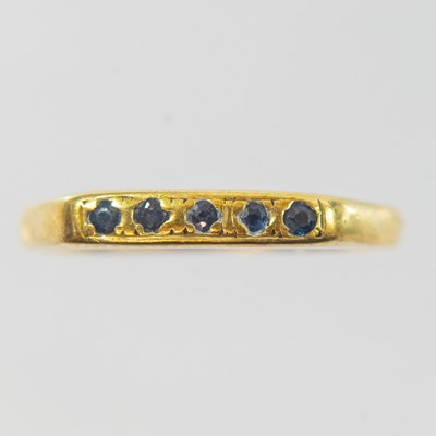 Lot 58 - An 18ct gold sapphire set five stone ring.