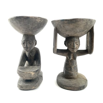 Lot 147 - Two African carved figural bowls the female...