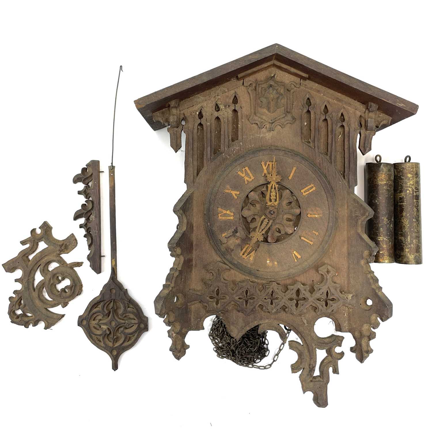 Lot 1702 - A Swiss Black Forest oak cuckoo wall clock,...