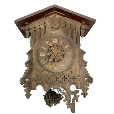 Lot 1702 - A Swiss Black Forest oak cuckoo wall clock,...