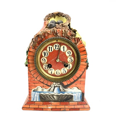 Lot 1703 - A French porcelain mantel clock, late 19th...