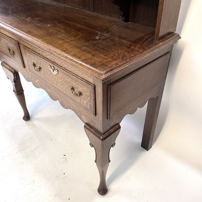 Lot 3 - A George III style oak and mahogany crossbanded dresser.