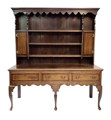 Lot 3 - A George III style oak and mahogany crossbanded dresser.