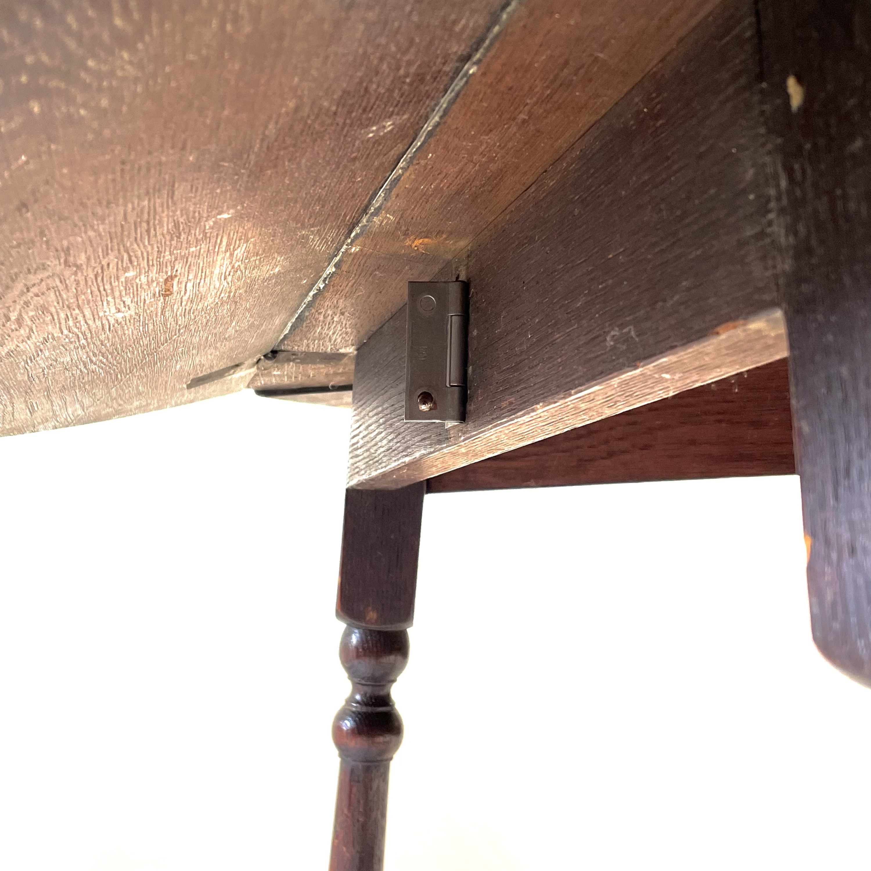 Lot 54 - An oak drop leaf occasional table, early 20th