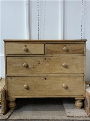 Lot 429e - A small pine chest of drawers with wooden knobs.