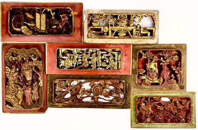 Lot 20 - Seven Chinese carved wood gilt and red painted panels, early 20th century.