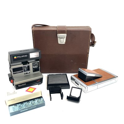 Lot 133 - A Polaroid SX-70 Land Camera in a leather...