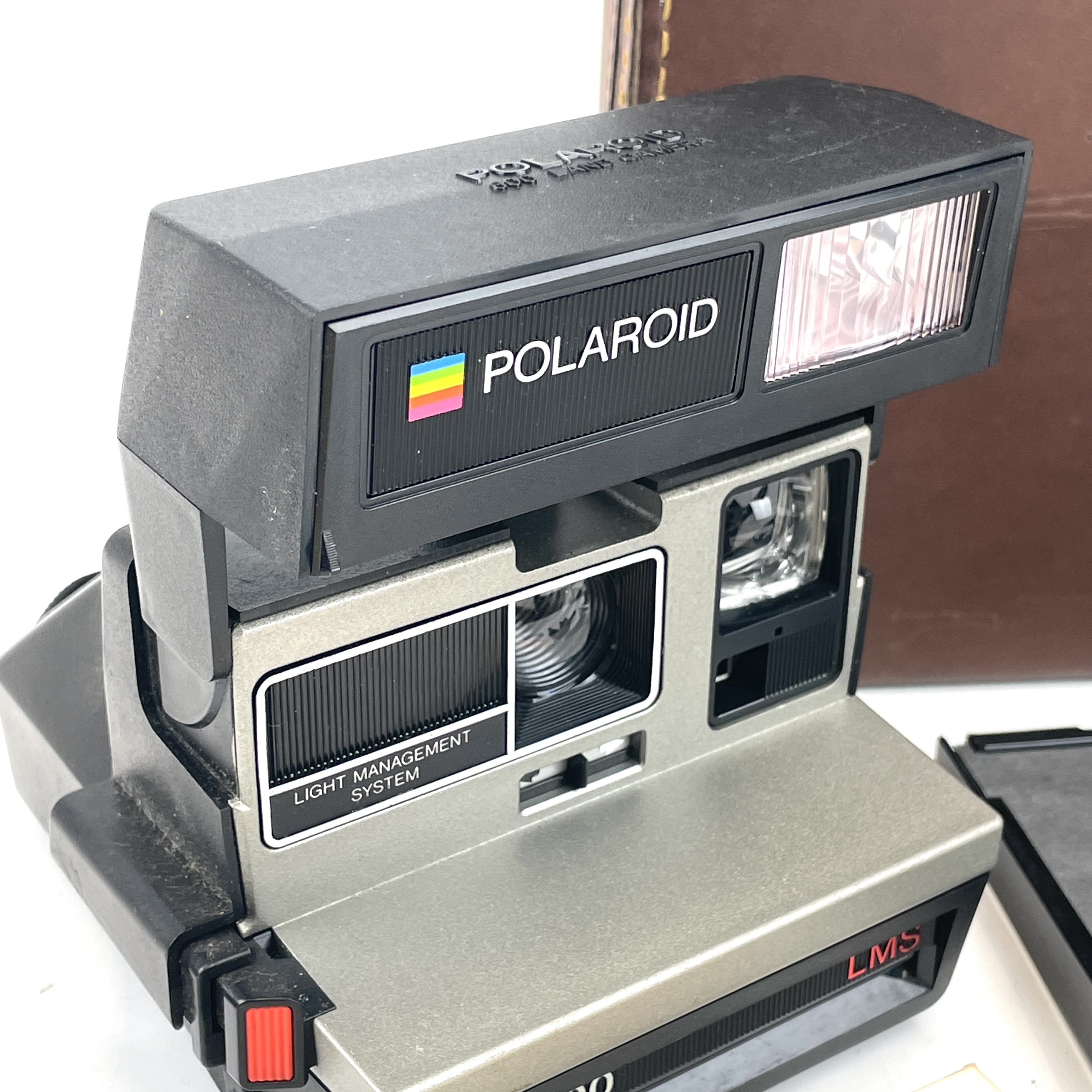 Lot 133 - A Polaroid SX-70 Land Camera in a leather