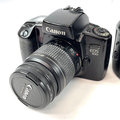 Lot 148 - A Canon EOS 1000F SLR camera serial number...