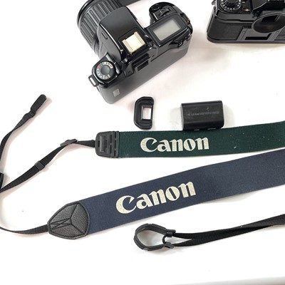 Lot 148 - A Canon EOS 1000F SLR camera serial number...