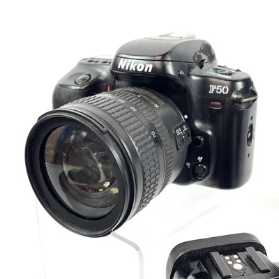 Lot 148 - A Canon EOS 1000F SLR camera serial number...