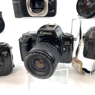 Lot 148 - A Canon EOS 1000F SLR camera serial number...