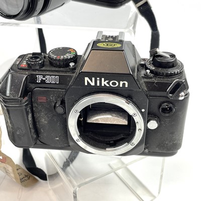 Lot 148 - A Canon EOS 1000F SLR camera serial number...