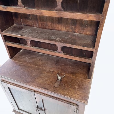 Lot 23 - A continental walnut kitchen dresser, 19th century.