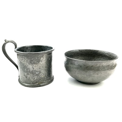 Lot 130 - An Arts and Crafts beaten pewter bowl by Hugh...