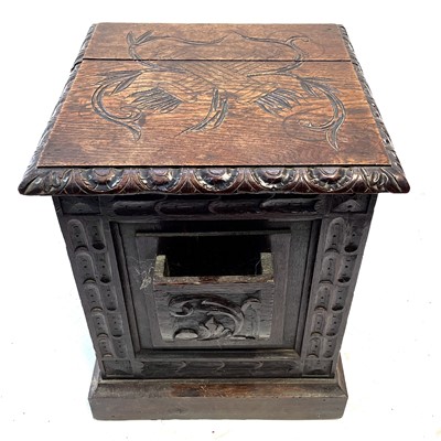 Lot 36 - A Victorian carved oak coal box.