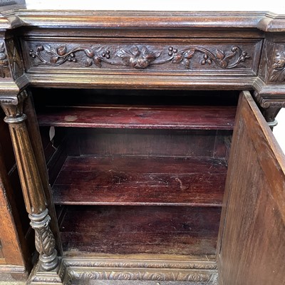 Lot 37 - A Victorian carved oak side cabinet.