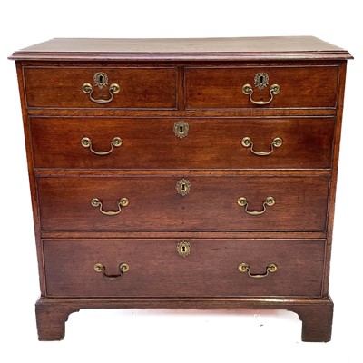 Lot 35 - A George III oak chest of drawers.