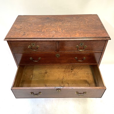 Lot 35 - A George III oak chest of drawers.