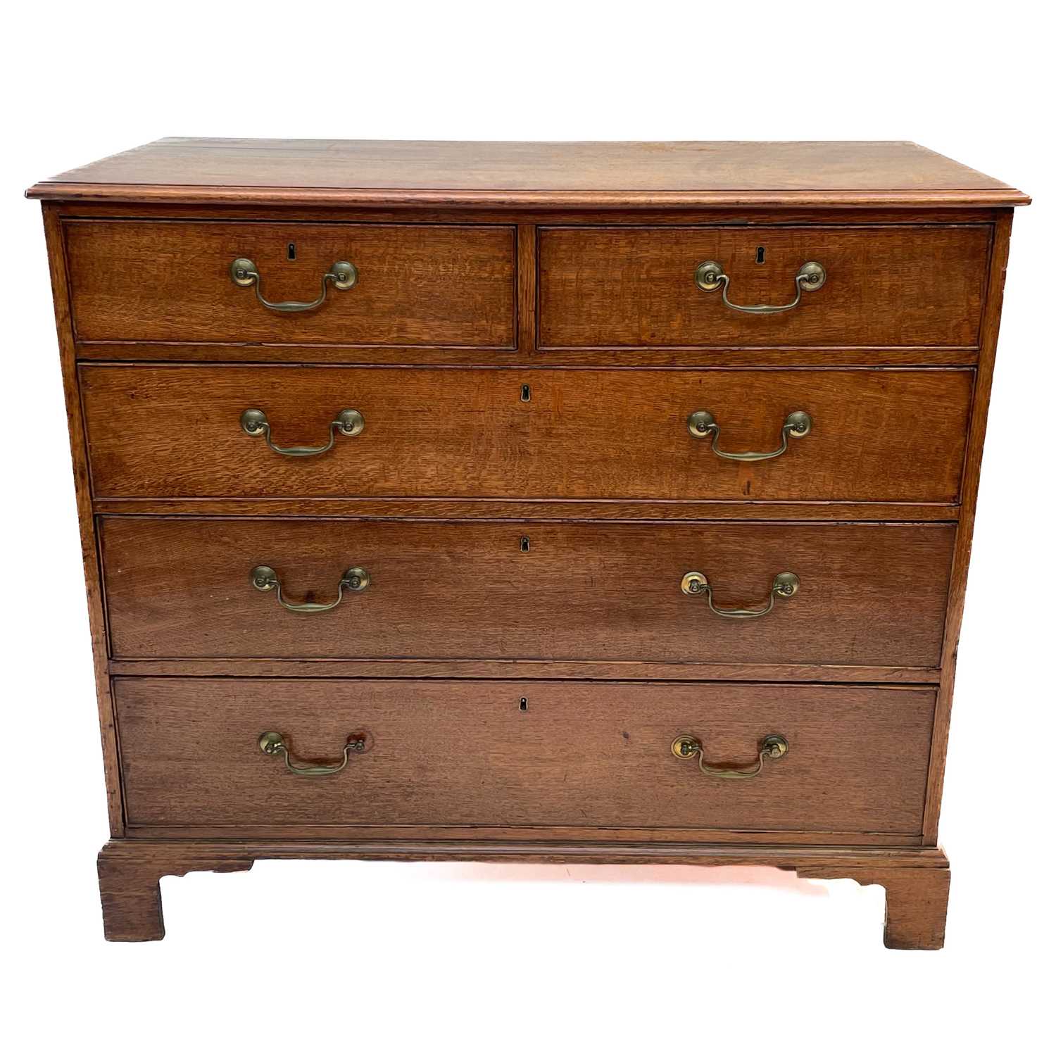 Lot 55 - A George III oak chest of drawers.