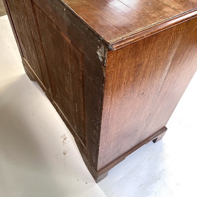 Lot 55 - A George III oak chest of drawers.