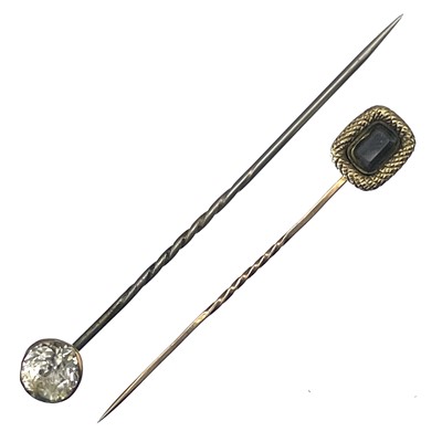 Lot 109 - Two 19th century stick pins.