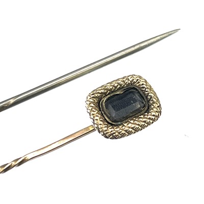 Lot 249 - Two 19th century stick pins.