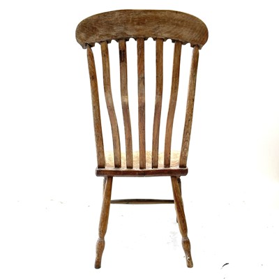 Lot 64 - A Victorian beech and elm lathe back kitchen chair.