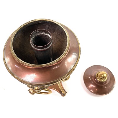 Lot 66 - A Regency copper and brass tea urn.