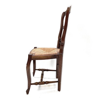 Lot 67 - A set of nine French oak dining chairs, circa 1900.