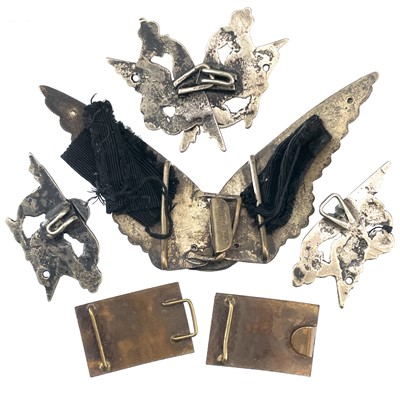 Lot 242 - A collection of belt buckles, including a silver plated owl buckle with glass inset eyes.