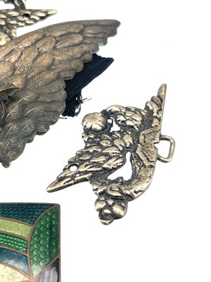 Lot 242 - A collection of belt buckles, including a silver plated owl buckle with glass inset eyes.