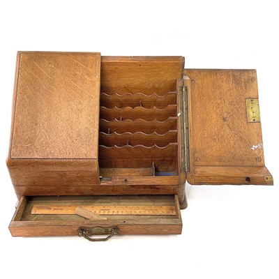 Lot 70 - A late Victorian oak stationery cabinet.