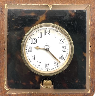 Lot 273 - An 8 day travel clock, in a faux tortoiseshell...