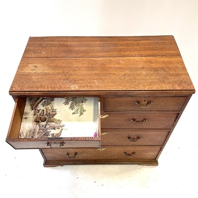 Lot 75 - A George III oak chest of drawers.