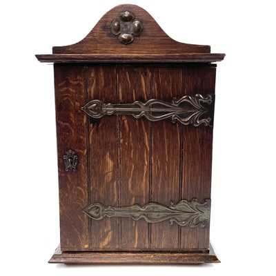 Lot 99 - An oak smokers cabinet, early 20th century.