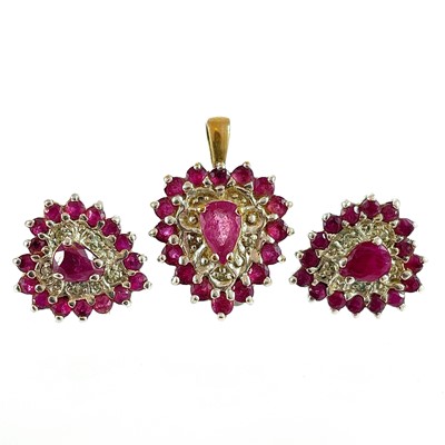 Lot 310 - A pair of diamond and ruby cluster stud earrings and a matching pendant.