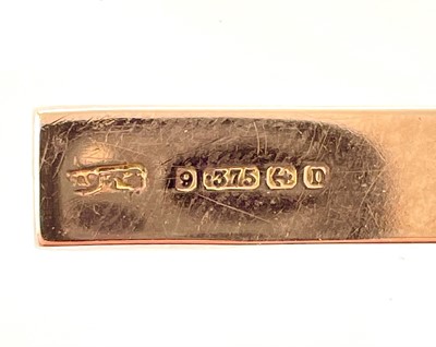 Lot 362 - A George V 9ct rose gold foliate engraved cross pendant.