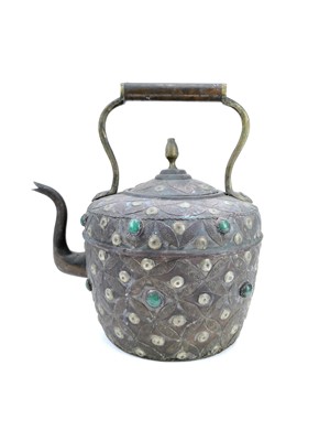 Lot 1025 - An Indian copper kettle with applied semi precious stones.