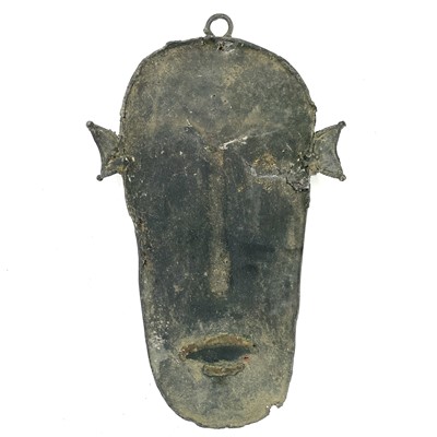 Lot 98 - An unusual African Benin type bronze wall mask,...