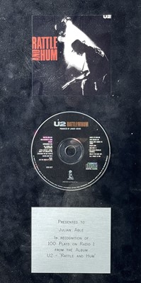 Lot 62 - A framed presentation CD by U2.