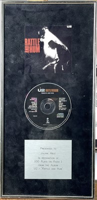 Lot 62 - A framed presentation CD by U2.