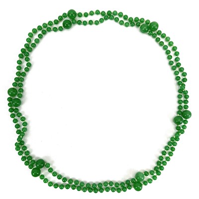 Lot 340 - A string of graduating apple jade beads.