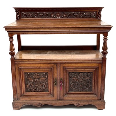 Lot 1860 - A late Victorian walnut buffet, with carved...