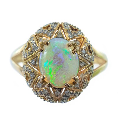 Lot 2 - An 18ct gold diamond and white opal dress ring
