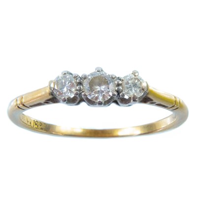 Lot 30 - An 18ct gold diamond set three stone ring.