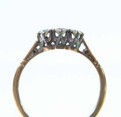 Lot 30 - An 18ct gold diamond set three stone ring.