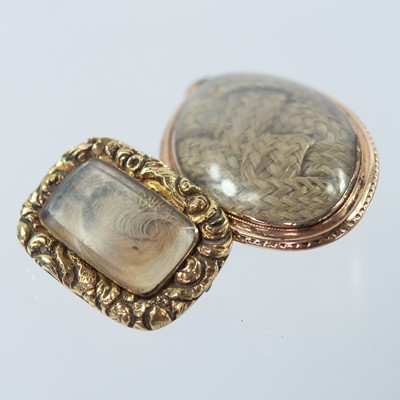 Lot 122 - Two 19th century gold mourning brooches.